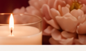 Candle and flowers in warm light