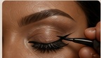 Close-up eye makeup foundation technique.