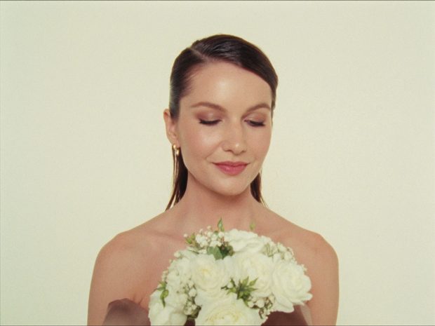 Client holding flowers after her boutique service