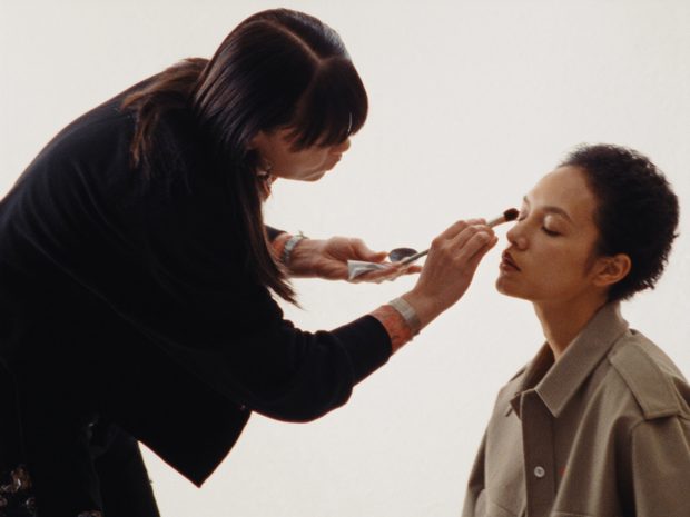 Artist creating a boutique makeup look